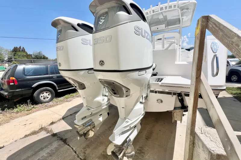 Slide: The Image of 2026 Stamas 33T Aventura boat with dual Suzuki 350 outboard engines. - 2