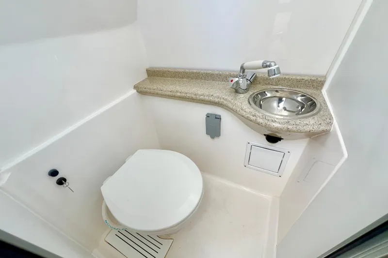 Slide: The Image of 2026 Stamas 33T Aventura boat bathroom with toilet, sink, and countertop. - 20
