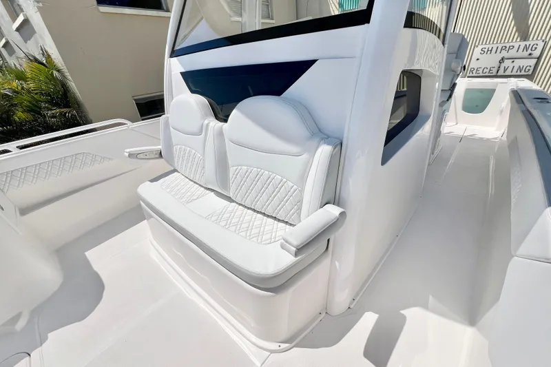 Slide: The Image of 2026 Stamas 33T Aventura boat with white cushioned seating and sleek design. - 25