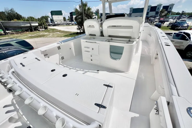 Slide: The Image of 2026 Stamas 33T Aventura boat deck with storage compartments and rod holders. - 6