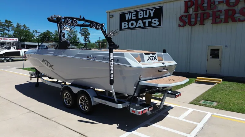 Slide: The Image of 2024 ATX TYPE S boat on trailer at boat dealership. - 3