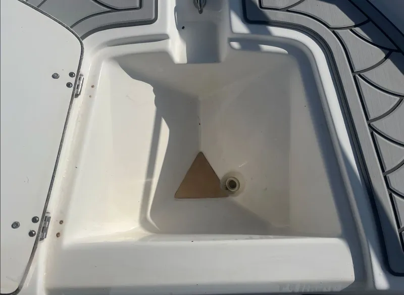 Slide: The Image of Interior of a 2002 Boston Whaler 130 Sport boat. - 14