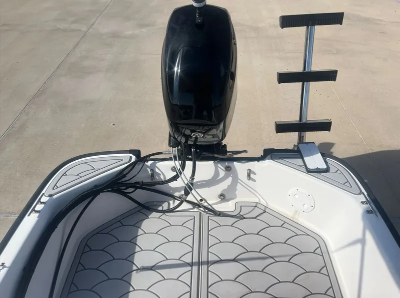 Slide: The Image of Boston Whaler 130 Sport 2002 with outboard motor and non-slip flooring. - 17