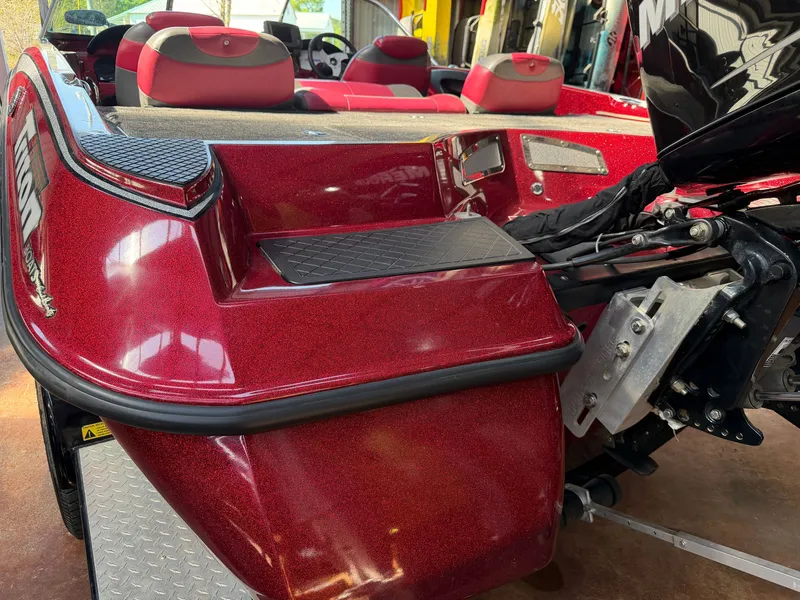 Slide: The Image of Red Triton 190 Escape 2010 boat hull with motor view. - 14