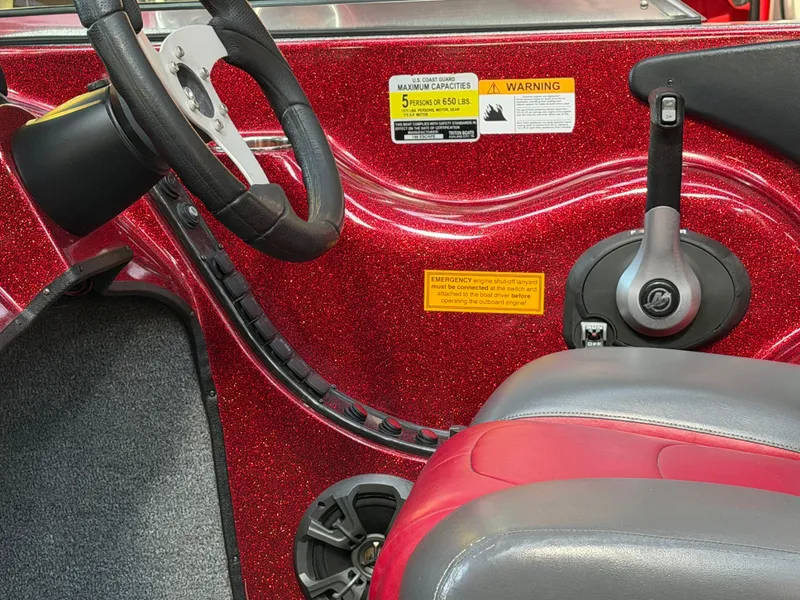 Slide: The Image of Interior of a 2010 Triton 190 Escape boat with red glitter finish. - 21