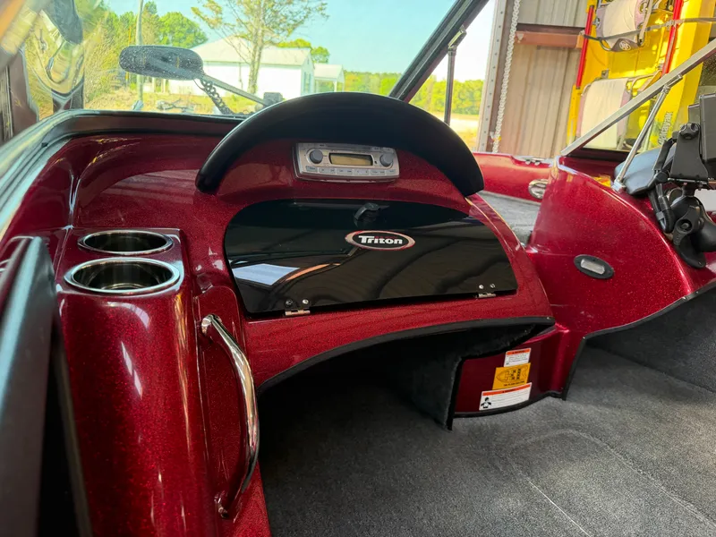 Slide: The Image of Interior of a 2010 Triton 190 Escape boat with dashboard. - 6