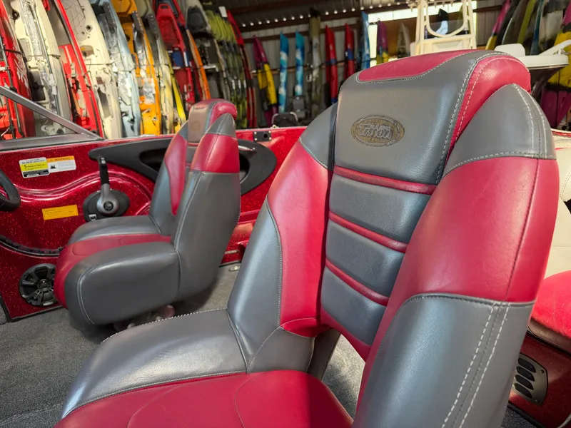 Slide: The Image of Interior of a 2010 Triton 190 Escape boat with red and gray seats. - 7