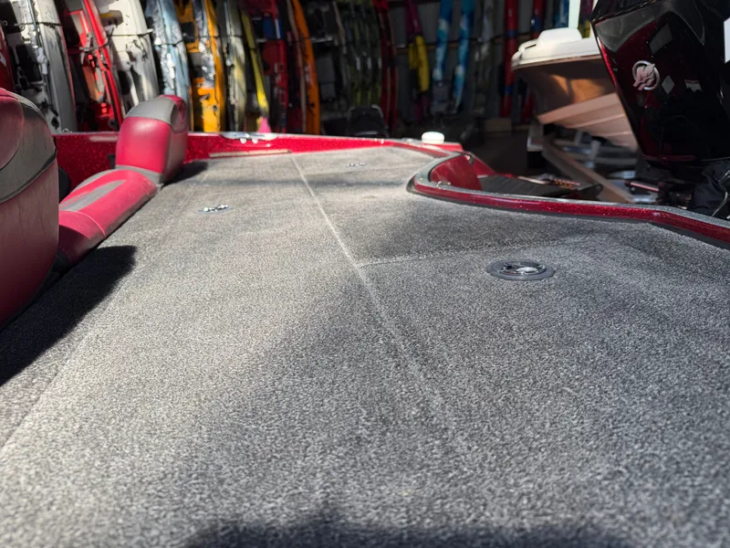 Slide: The Image of Triton 190 Escape 2010 boat deck with gray carpet. - 9