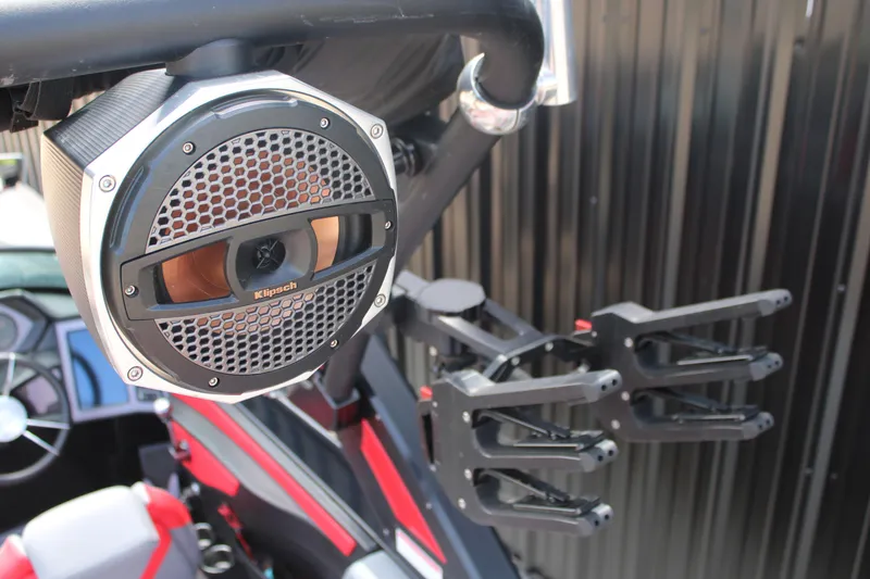 Slide: The Image of 2024 MasterCraft XStar S boat with Klipsch speaker and wakeboard rack. - 13