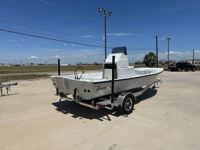 Slide: The Image of 2026 Shoalwater 20' Catamaran on trailer under sunny skies. - 9