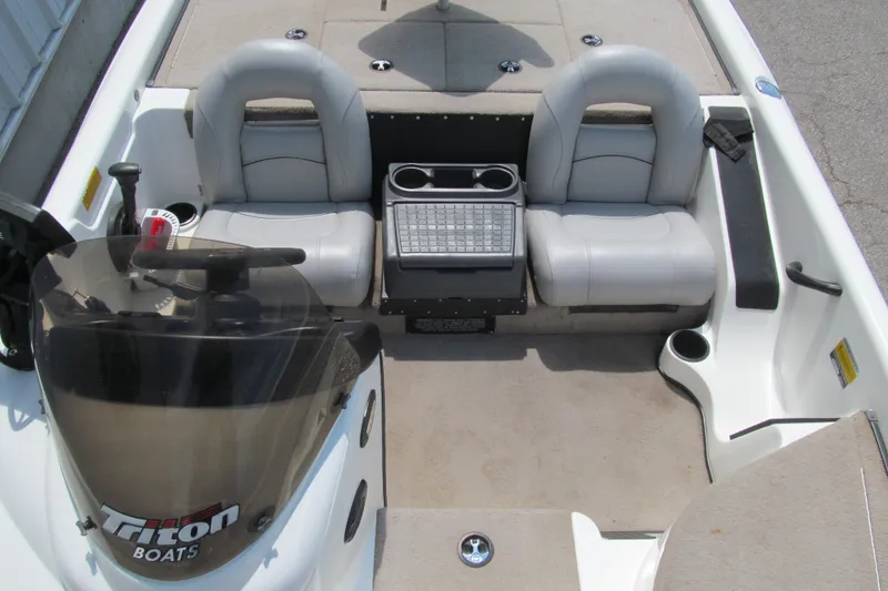 Slide: The Image of 2002 Triton Tr-176 SC boat interior with dual seats and steering console. - 11