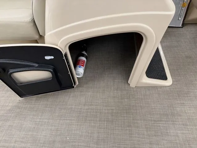 Slide: The Image of Open storage compartment in 2019 Sun Tracker SportFish 22 DLX boat. - 12