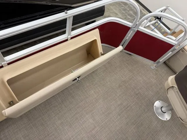 Slide: The Image of Interior of a 2019 Sun Tracker SportFish 22 DLX with storage compartment. - 22