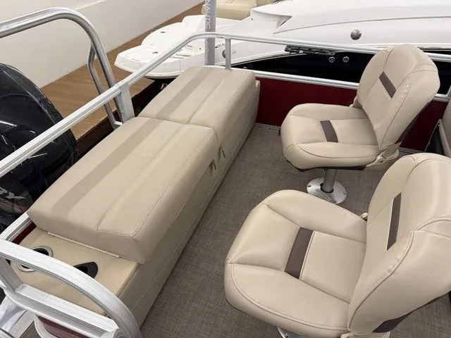 Slide: The Image of Interior of a 2019 Sun Tracker SportFish 22 DLX with beige seating. - 26