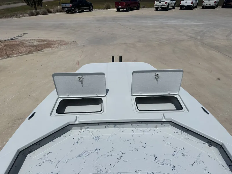 Slide: The Image of 2026 Shoalwater 23' Catamaran with open storage compartments on deck. - 14