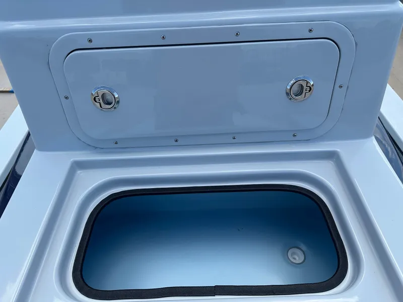 Slide: The Image of 2026 Shoalwater 23' Catamaran storage compartment and lid. - 16