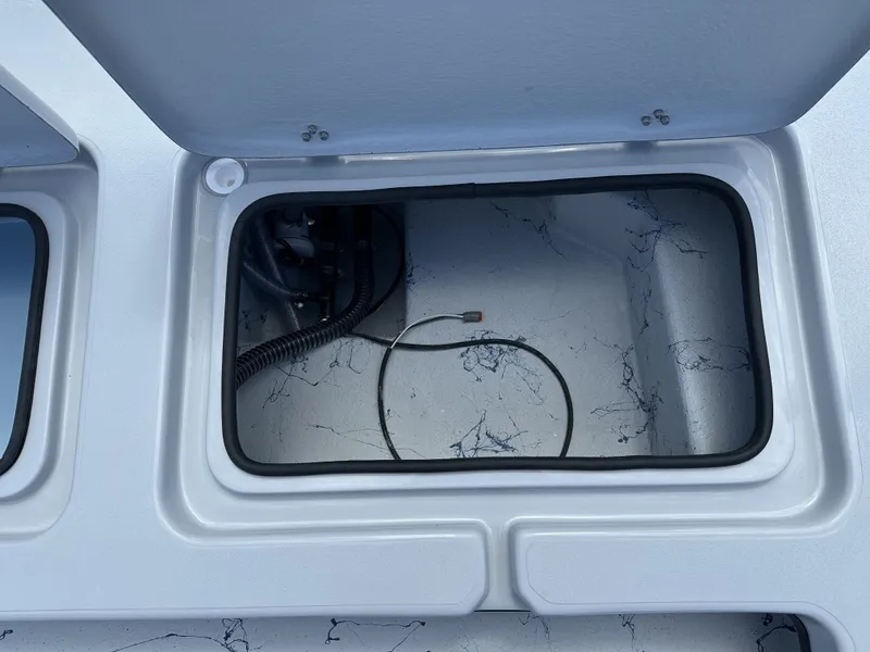 Slide: The Image of Open storage compartment in Shoalwater 23' Catamaran 2026. - 21