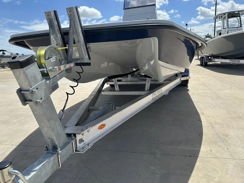Slide: The Image of 2026 Shoalwater 23' Catamaran on trailer under sunny skies. - 5