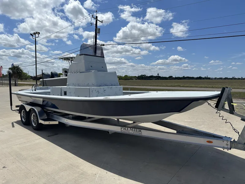 Slide: The Image of 2026 Shoalwater 23' Catamaran on trailer under blue sky. - 6