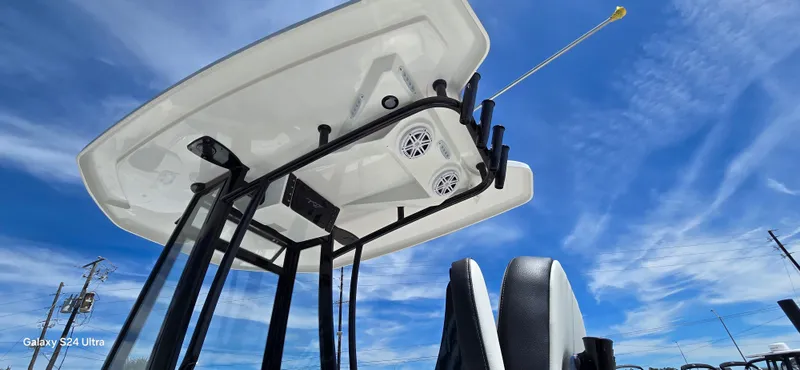 Slide: The Image of Tidewater 220 LXF 2026 boat with speakers and blue sky. - 12