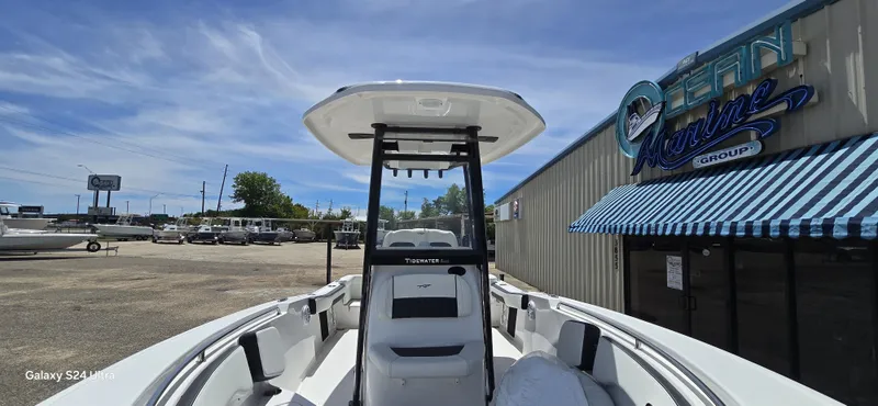 Slide: The Image of Tidewater 220 LXF 2026 boat in front of a marine shop. - 6