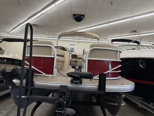 Slide: The Image of 2019 Sun Tracker SportFish 22 DLX pontoon boat in showroom. - 3