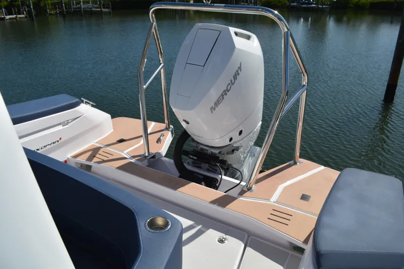 Slide: The Image of 2025 Axopar 29 Sun-Top boat with Mercury engine on calm water. - 7