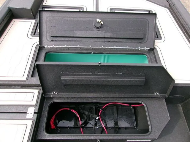 Slide: The Image of Avid 18 Commander 2026 boat battery compartment with cables. - 7