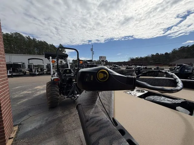 Slide: The Image of 2026 Xpress H20C Crappie boat in a parking lot under cloudy sky. - 16