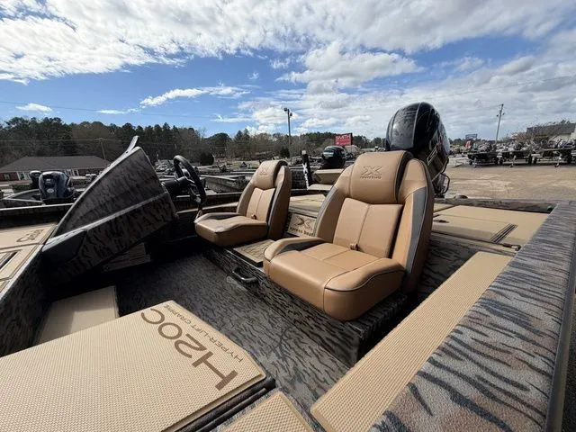 Slide: The Image of 2026 Xpress H20C Crappie boat with luxurious seating. - 18