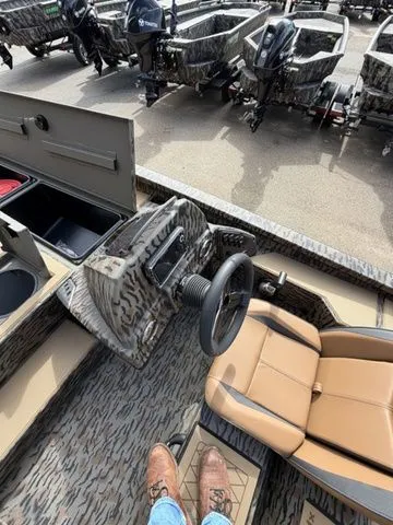 Slide: The Image of Interior view of 2026 Xpress H20C Crappie with steering wheel and seat. - 24