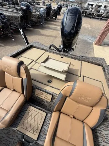 Slide: The Image of 2026 Xpress H20C Crappie boat interior with tan seats. - 26