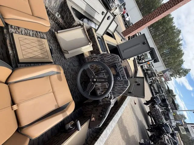 Slide: The Image of Interior of 2026 Xpress H20C Crappie with steering wheel and seats. - 27