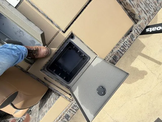 Slide: The Image of Xpress H20C Crappie 2026 boat with open storage compartment. - 28