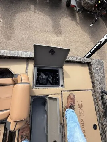 Slide: The Image of Interior view of 2026 Xpress H20C Crappie boat with storage compartment. - 32