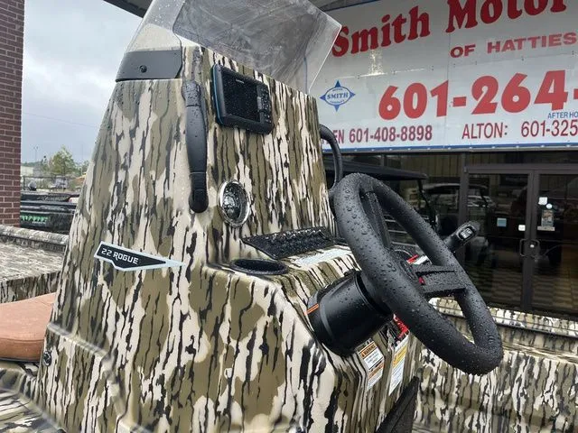 Slide: The Image of Avid 22 Rogue 2026 boat with camouflage pattern and steering console. - 15
