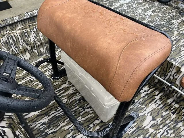 Slide: The Image of Avid 22 Rogue 2026 boat with brown seat and steering wheel. - 16