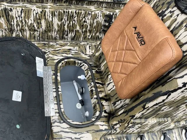 Slide: The Image of Interior of Avid 22 Rogue boat, 2026 model, featuring cushioned seat. - 18