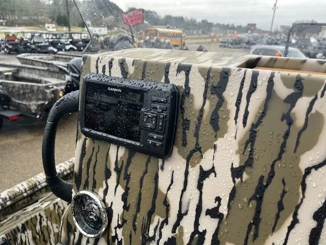 Slide: The Image of Garmin device on a 2026 Avid 22 Rogue boat with camouflage pattern. - 23