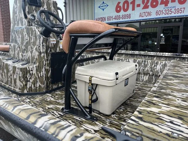 Slide: The Image of Avid 22 Rogue 2026 boat with camouflage design and cooler. - 7