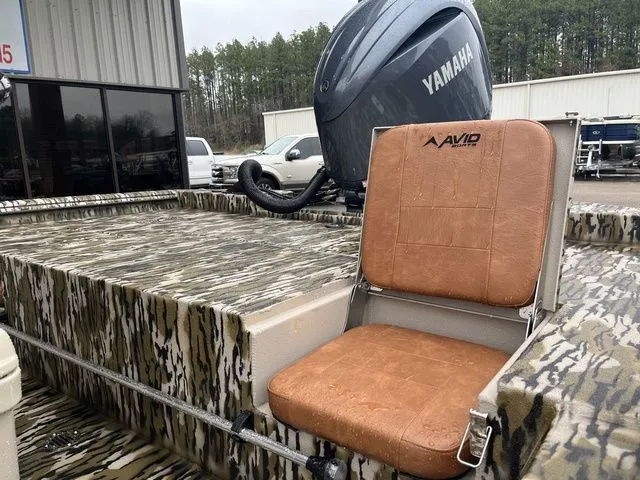 Slide: The Image of Avid 22 Rogue boat 2026 with Yamaha engine and camouflage pattern. - 8