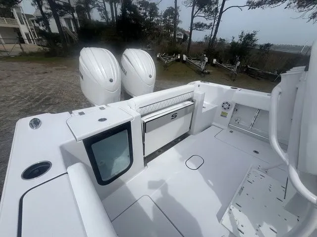 Slide: The Image of Sportsman Open 252 Center Console 2026 with dual outboard engines. - 11