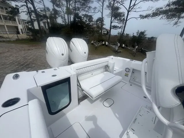 Slide: The Image of 2026 Sportsman Open 252 Center Console with dual outboard engines. - 12