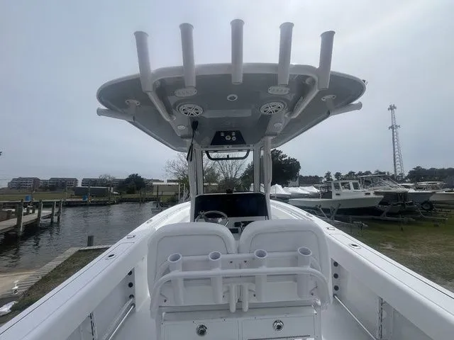 Slide: The Image of 2026 Sportsman Open 252 Center Console boat at dock. - 13