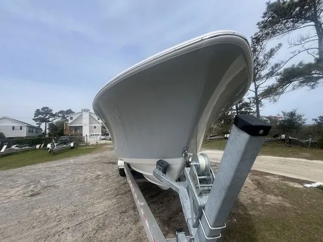 Slide: The Image of 2026 Sportsman Open 252 Center Console on trailer, side view. - 2