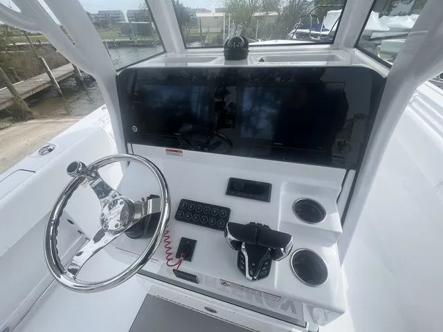 Slide: The Image of 2026 Sportsman Open 252 Center Console helm with modern electronics. - 9