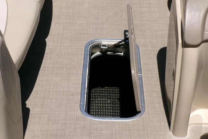 Slide: The Image of Open storage compartment on 2015 Manitou 25 SES Flip boat deck. - 11