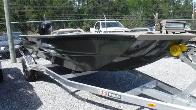 Slide: The Image of 2026 Excel Boats River Warrior 1751 on trailer, parked outdoors. - 4