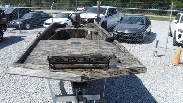 Slide: The Image of 2026 Excel Boats Eclipse 17’ in a parking lot, featuring camouflage design. - 3