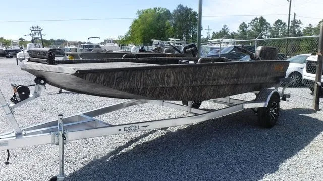 Slide: The Image of 2026 Excel Boats Eclipse 17’ on trailer, parked outdoors. - 4